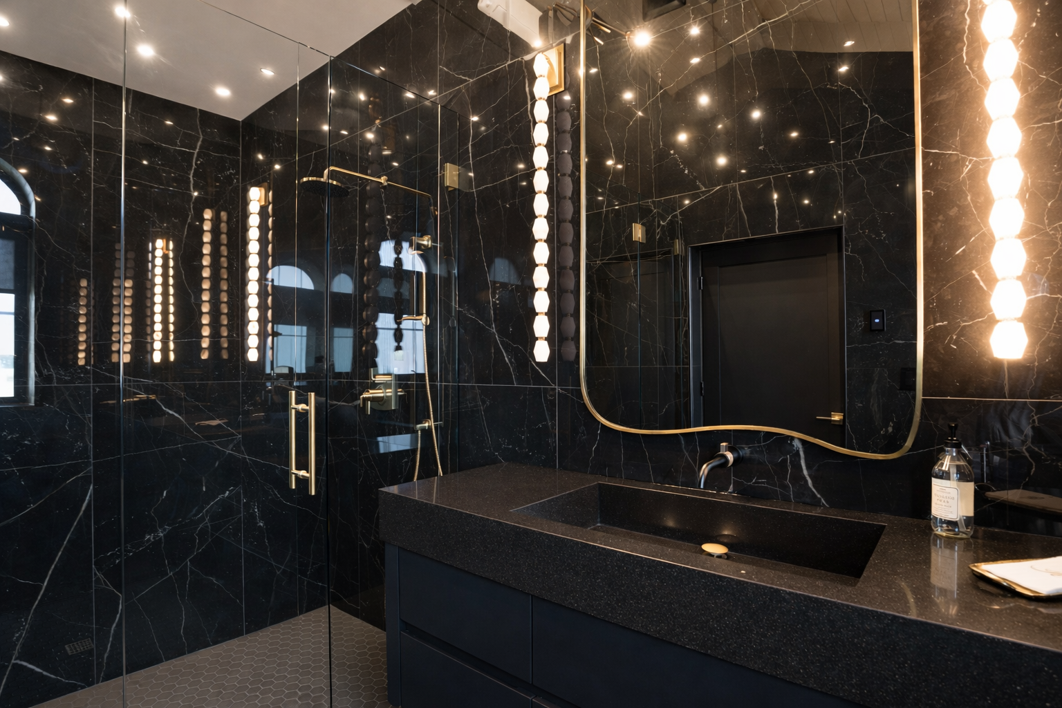 Black marble bathroom with accent lighting